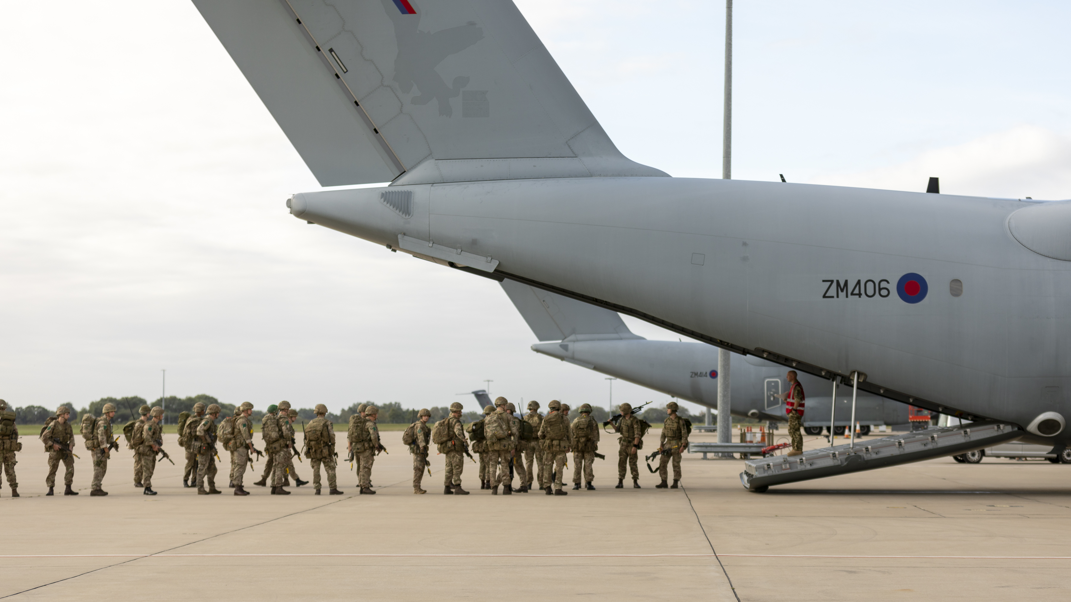 Image shows RAF personnel standing by the loading bay of Atlas aircraft.